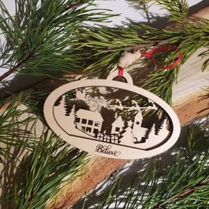 3D Santa flying over town ornament